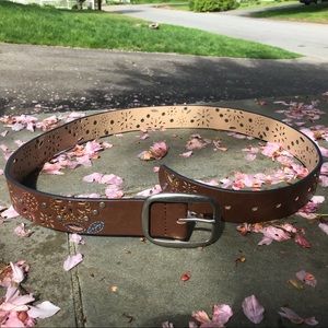 Floral cutout, studded brown belt